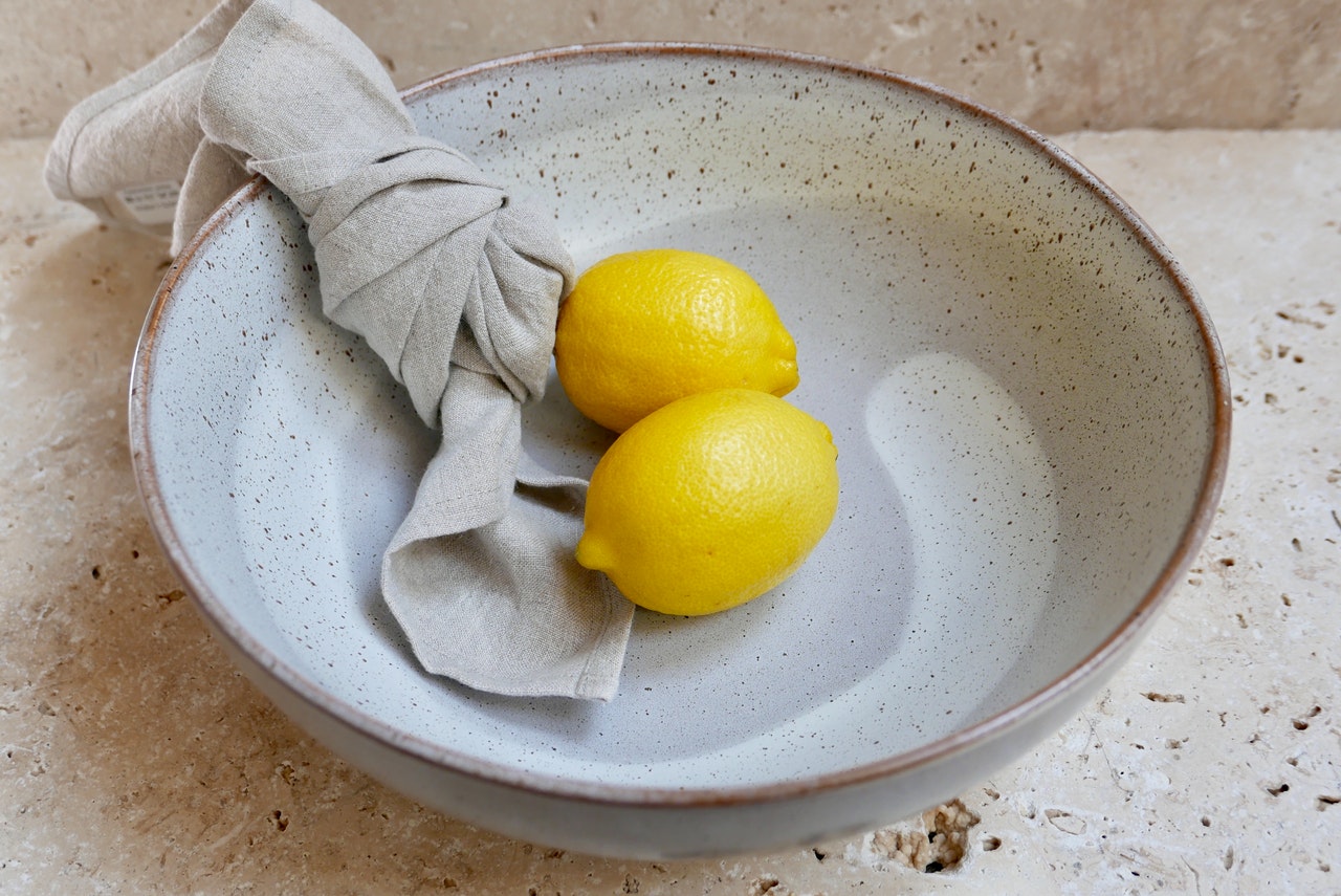 Lovely napkin knot in a bowl with lemons